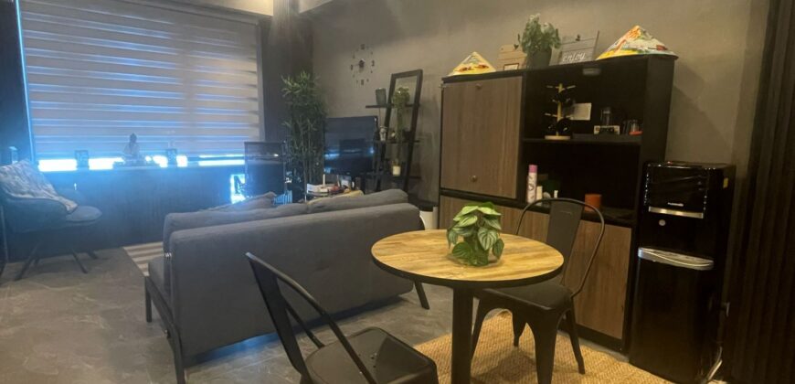 A nicely interior 1-bedroom unit for sale at Eastwood Parkview Tower 2, conveniently located above Eastwood Mall in Libis, Quezon City.